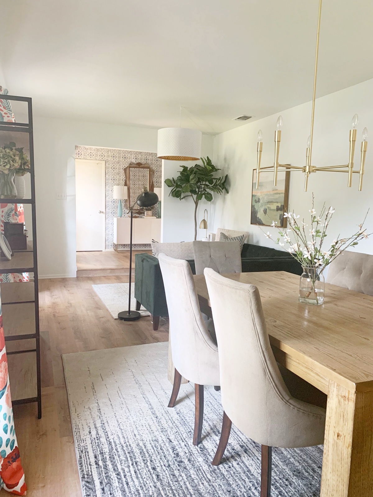 Dining area with light-wood table and upholstered chairs