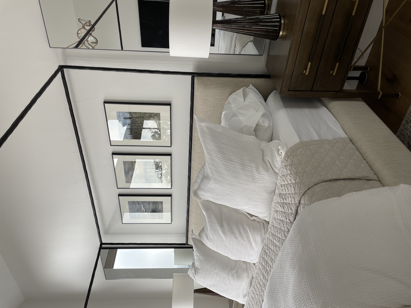 Canopy bed dressed in white linens