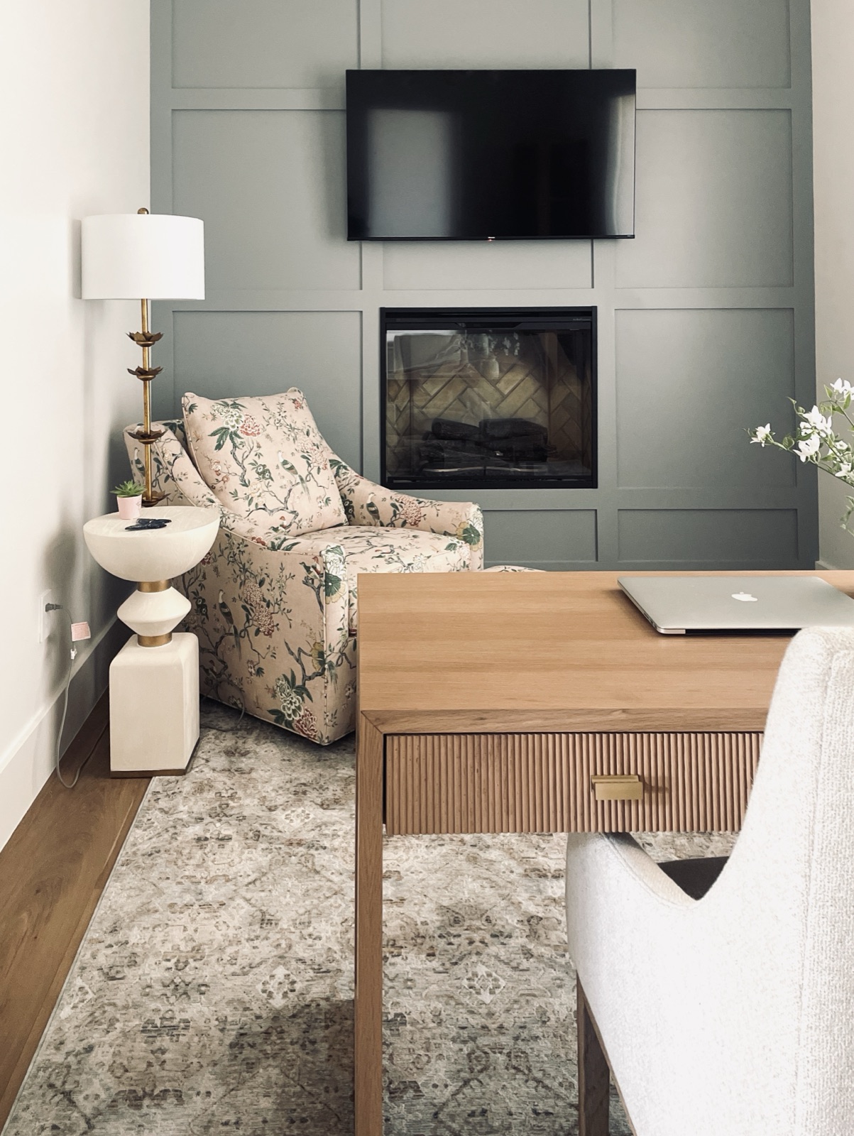 Media wall with paneled fireplace and writing desk